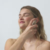 scene 1 - person applying the face mist to their face, scene 2 - close up of person applying the concealer to their face. scene 3 - close up of person applying the sweet mint lip conditioner to their lips